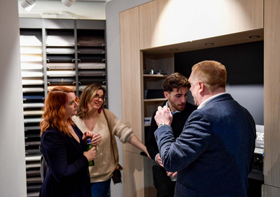 People talking in a kitchen showroom