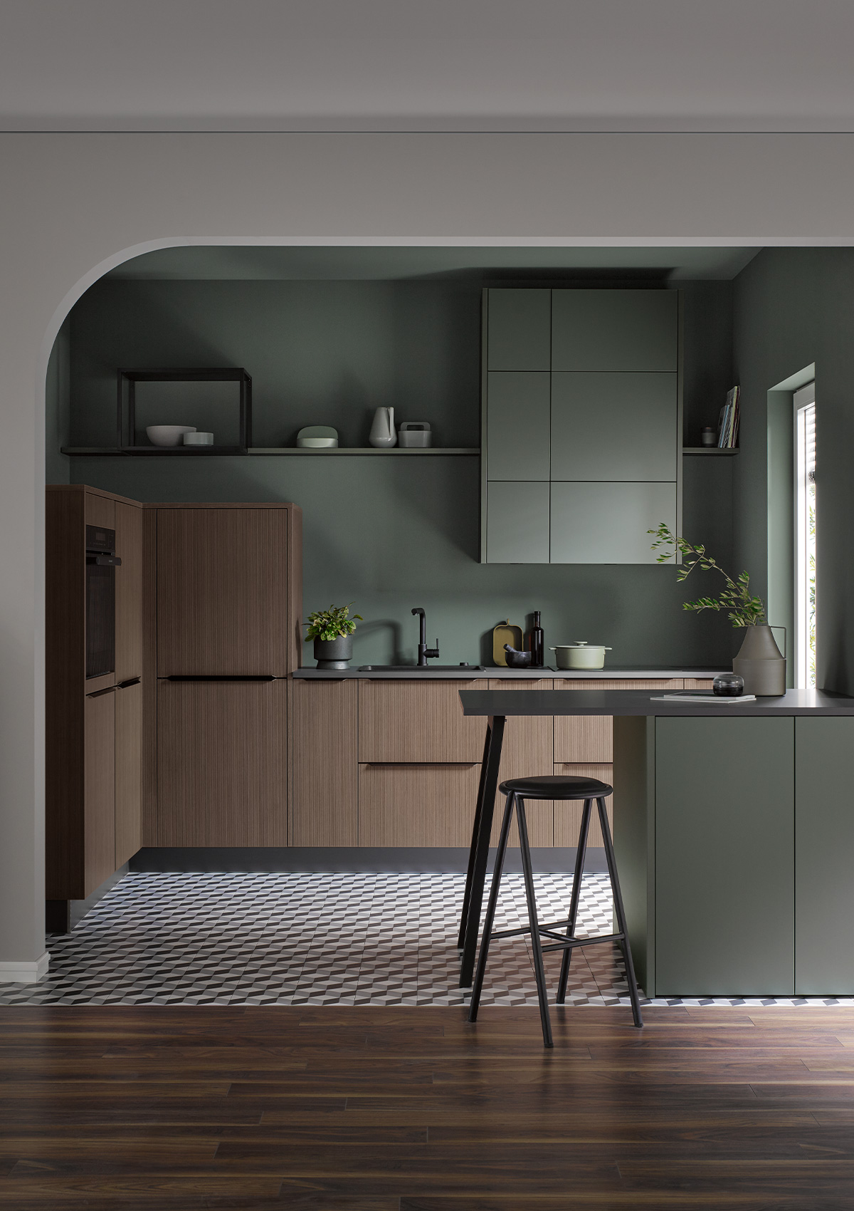 Modern Dark Forest Green Häcker Kitchen with warm wood accents.